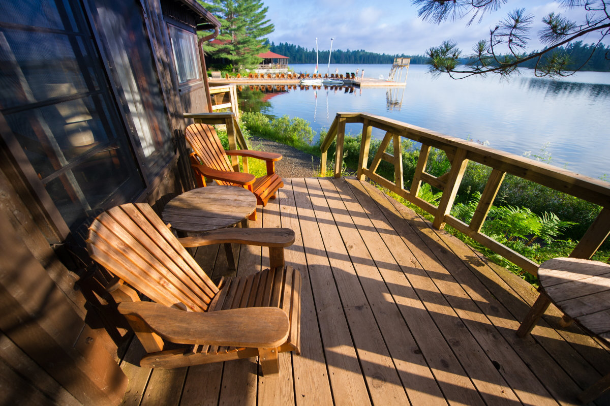 cottage chairs overlooking lake