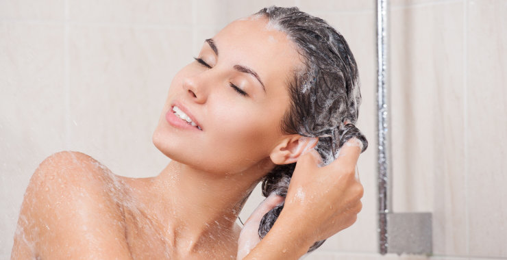 woman washing hair in shower